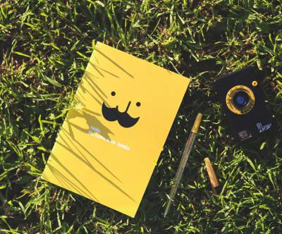 photo-yellow-notebook-grass-relax